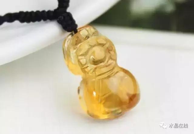 黄水晶千手观音吊坠真假,纯净体黄水晶怎么辨别真假