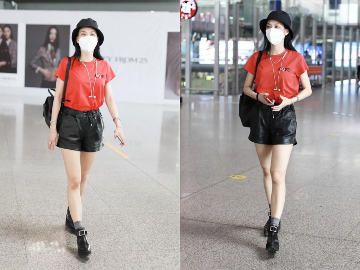 王霏霏黑西装齐刘海,王霏霏机场粉色包包